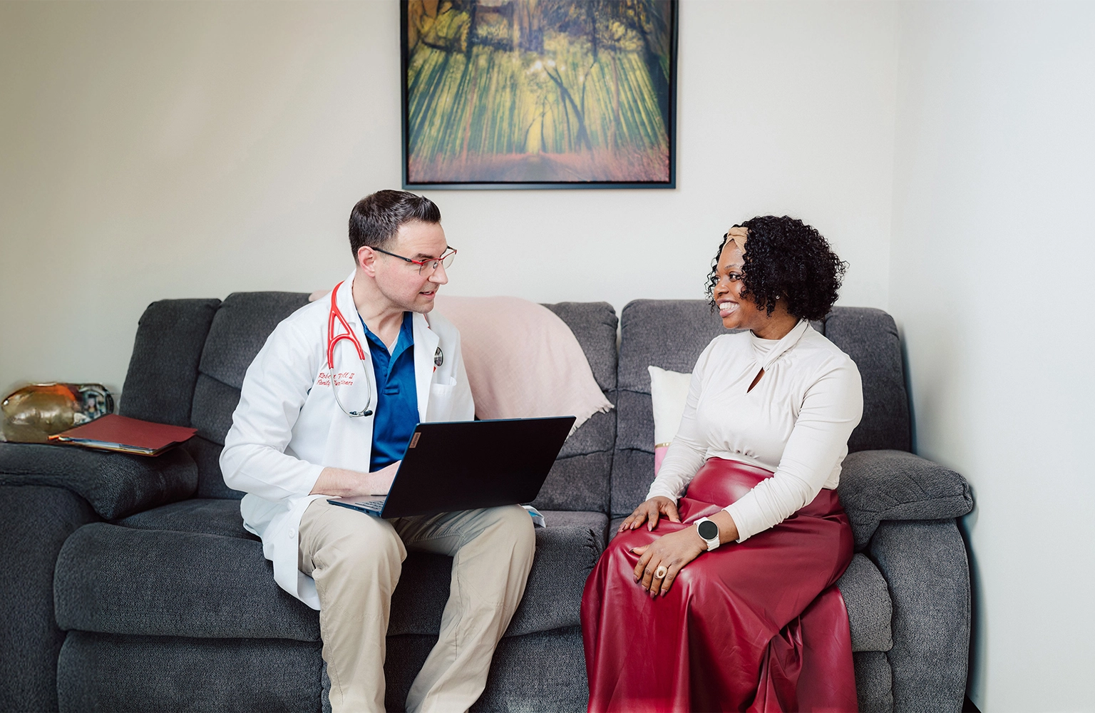 Doctor discussing health with a patient during a primary care visit