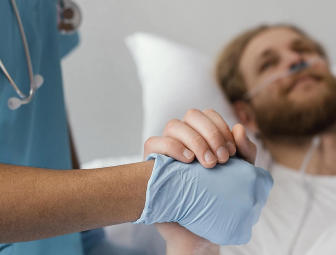 Elderly man receiving palliative care support at home